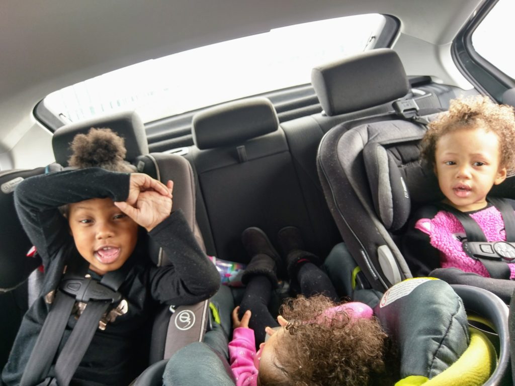 Kids in backseat on road trip